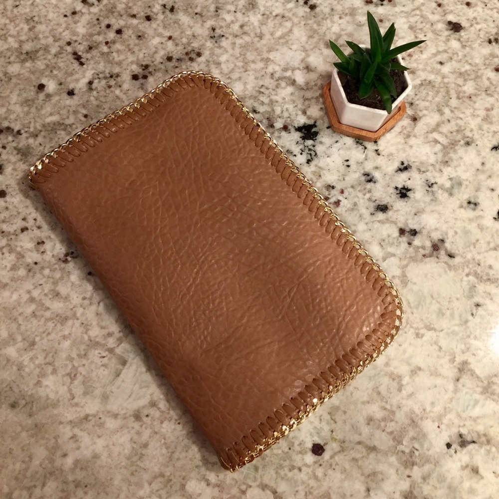 Edgy tan clutch with chain detailing